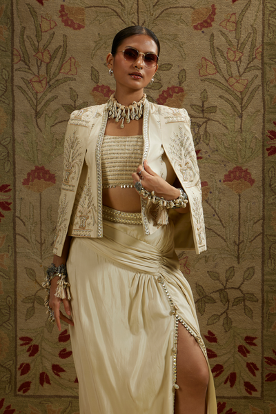 SVA Womenswear Magnolia Cream Embellished Butta Cape Jacket Paired with Metal Embellished Bustier and Slit Skirt Online Shopping Melange Singapore Indian Designer Wear