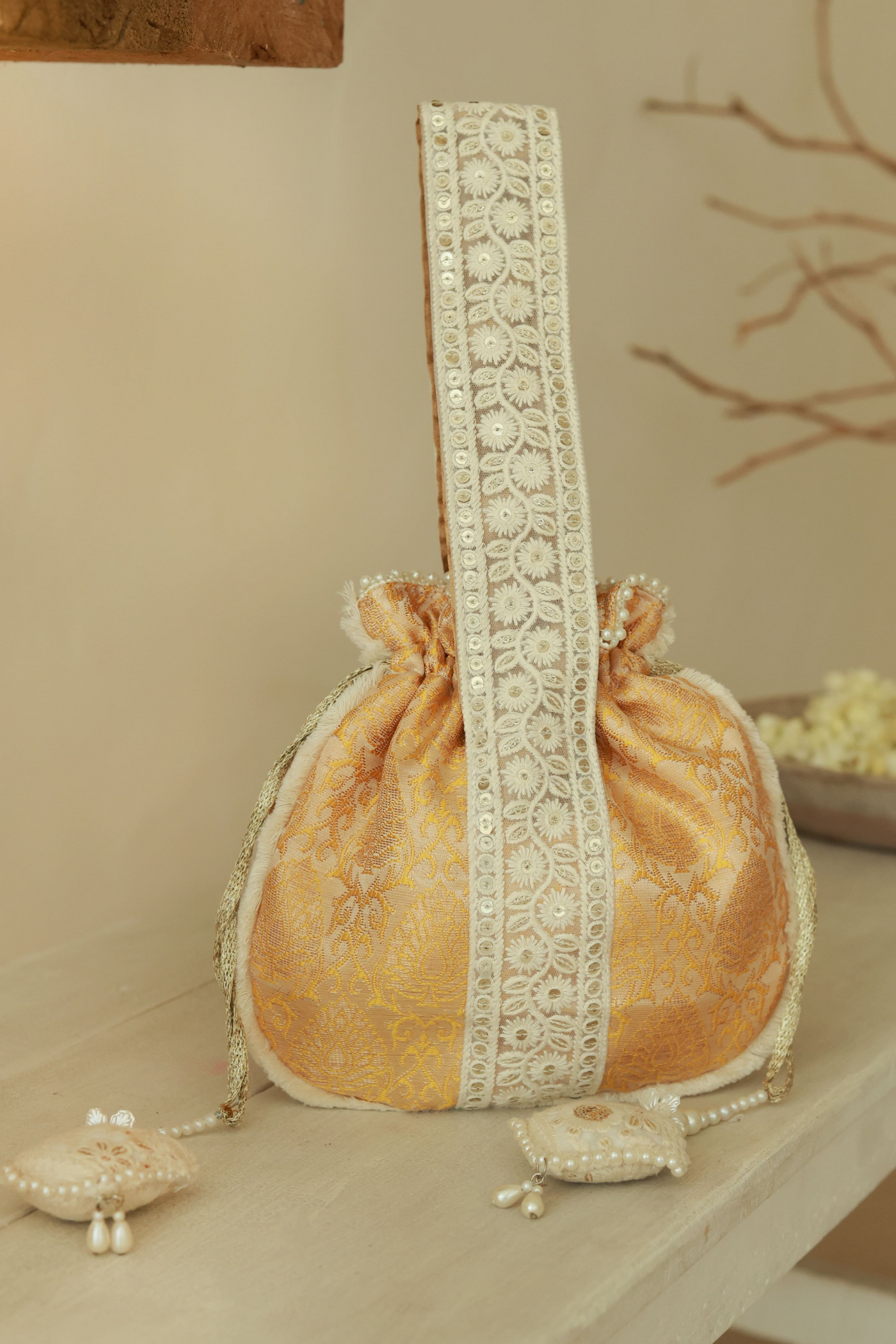 The Tan Clan Ruhi Potli Bag with Handle Yellow Indian Designer Wear Melange Singapore Online Shopping Womenswear Gifting